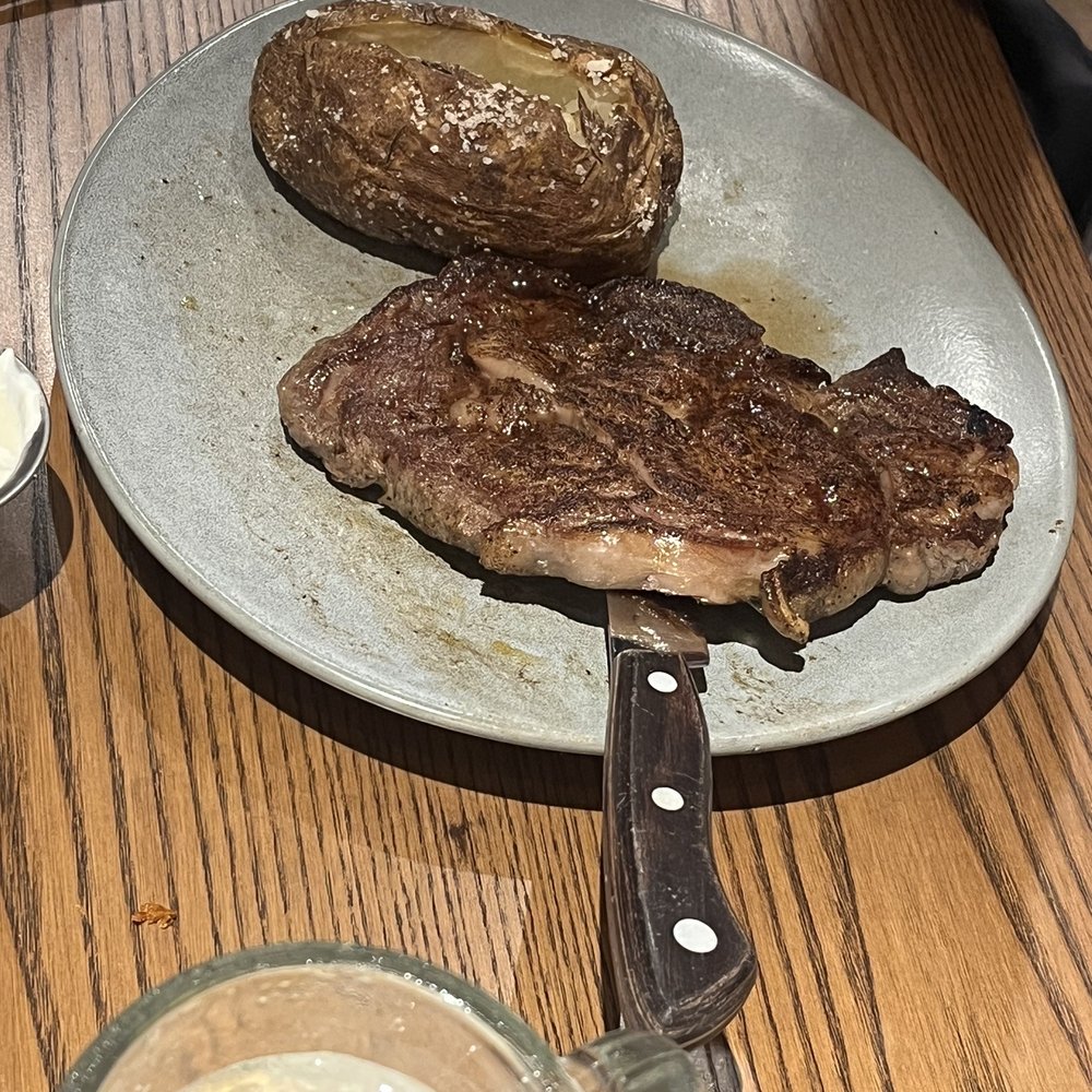 Outback Steakhouse - Ribeye* 13 oz. with a baked potato - Steakhouses Near Me - Miami, Florida Outback Steakhouse - Ribeye* 13 oz. with a baked potato - Steakhouses Near Me - Miami, Florida