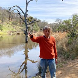 Flat Frog Trail - This is me at Frog Lake.  At side of this lake is a huge cluster of tall reeds.  In middle is a tall dead tree.  I'm holding triangle rock.