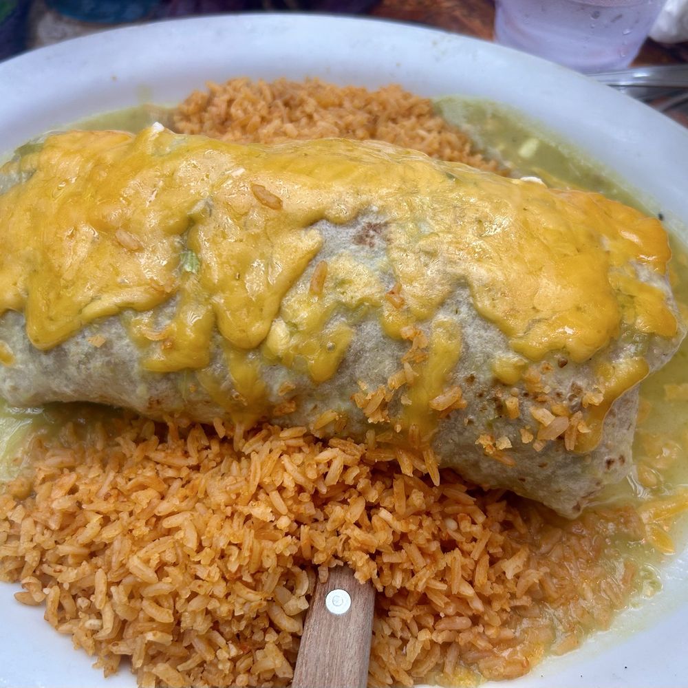 La Cabana - El Verde is a massive burrito smothered in a savory sauce made from green chiles and melted cheese. - Mexican Near Me - Venice, California La Cabana - El Verde is a massive burrito smothered in a savory sauce made from green chiles and melted cheese. - Mexican Near Me - Venice, California