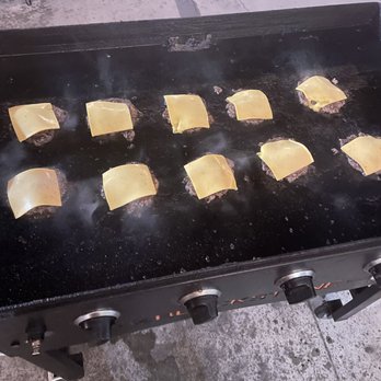 Hap’s Burgers - a grill with a lot of food on it - Pop-Up Restaurants Near Me