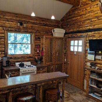 Silvertip Cabins - View from Living Room into kitchen/front door. - Vacation Rentals Near Me - Silver Gate, Montana
