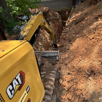 Choice One Plumbing - Our excavator in action during a deep sewer and water line install--precision work, built to last. - Plumbing Near Me - Maryville, Tennessee Choice One Plumbing - Our excavator in action during a deep sewer and water line install--precision work, built to last. - Plumbing Near Me - Maryville, Tennessee