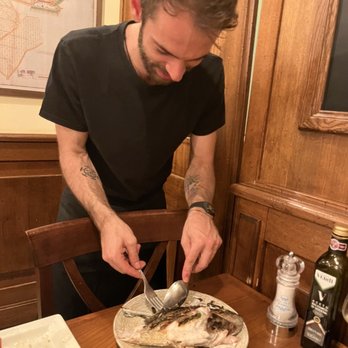 La Cantinetta Osteria con Cucina - Our excellent server filleting my grilled sea bass perfectly. - Italian Near Me - Florence, FI