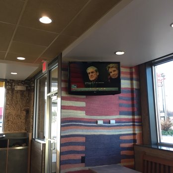 McDonald's - two men on a television above a table - Burgers Near Me - Effingham, Illinois McDonald's - two men on a television above a table - Burgers Near Me - Effingham, Illinois