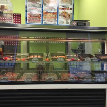 Kingdom Fish Market - a display case with a variety of food items - Seafood Markets Near Me - Perris, California Kingdom Fish Market - a display case with a variety of food items - Seafood Markets Near Me - Perris, California