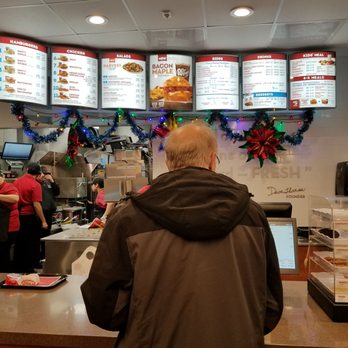 Wendy's - a man standing in front of a counter - Fast Food Near Me - Aurora, Illinois Wendy's - a man standing in front of a counter - Fast Food Near Me - Aurora, Illinois