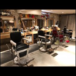 Village Cigar Company & Barbershop - Sit for a haircut, hot towel straight razor shave or expert beard trim.