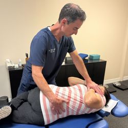 Kingwood Chiropractic Spine and Injury Center - Kingwood Chiropractic doctor Tyler Hamel DC performing lower back adjustment for lower back pain and Sciatica for whiplash injuries.
