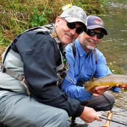 Kinni Creek Lodge & Outfitters - Happy fly fishing customer with one of our guides!