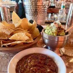 Happy hour- bottle of wine, chips, salsa and guacamole for $20