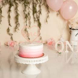 a cake with a heart topper a cake with a heart topper