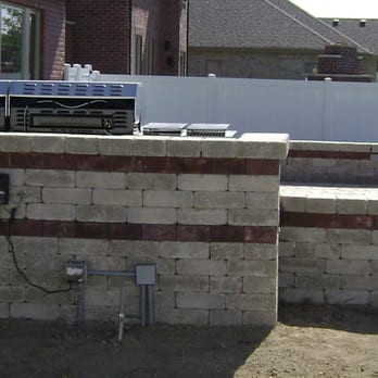 Courtyard Services - an outdoor kitchen with a grill - Landscaping Near Me - Dyer, Indiana