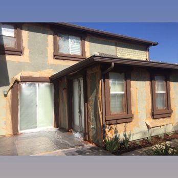 Pro Choice Decor - Side profile of mid process of full exterior repaint. - Painters Near Me