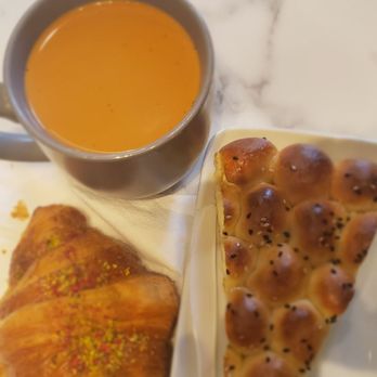 Sana'a Cafe - Amenities Chai; Honeycomb; Pistachio Raspberry Croissant. - Coffee Roasteries Near Me - Oakland, California Sana'a Cafe - Amenities Chai; Honeycomb; Pistachio Raspberry Croissant. - Coffee Roasteries Near Me - Oakland, California