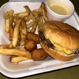 Charcoal burger cook out style no onions, add cheese, fries, and hush puppies delicious with the honey mustard from the back.