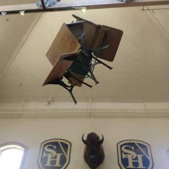 School House Kitchen & Libations - Desks hanging from the ceiling - New American Near Me - Arvada, Colorado School House Kitchen & Libations - Desks hanging from the ceiling - New American Near Me - Arvada, Colorado