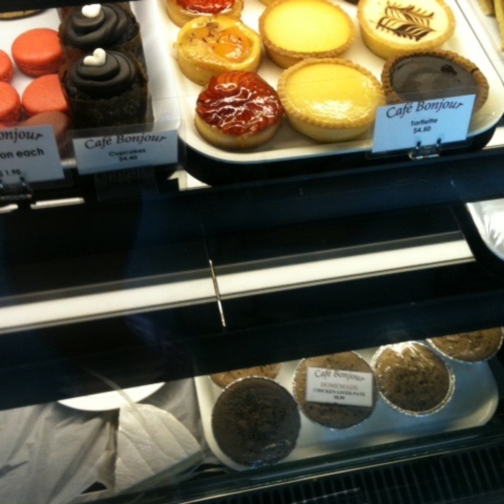 Cafe Bonjour - Delicious Tarts and cakes on top and French cheese and pâté at the bottom shelf - Cafes Near Me - Auckland, AUK
