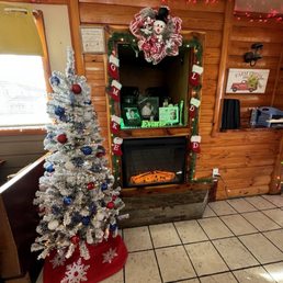 Red, white and blue decorated Christmas tree, as well as their memorial to family members. Red, white and blue decorated Christmas tree, as well as their memorial to family members.