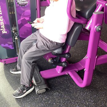 Planet Fitness - Watching a YouTube video deep in thought - Gyms Near Me - Oakland, California Planet Fitness - Watching a YouTube video deep in thought - Gyms Near Me - Oakland, California