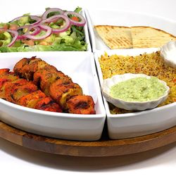 Gyros & Kabobs - Chicken Kabob Plate -
Rice, 2 Skewers of Marinated Chicken Cubes, Salad, Chutney, and Pita