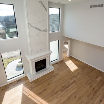 Lancaster Stones - a living room with hardwood floors and a fireplace - Countertop Installation Near Me - Kinzers, Pennsylvania Lancaster Stones - a living room with hardwood floors and a fireplace - Countertop Installation Near Me - Kinzers, Pennsylvania