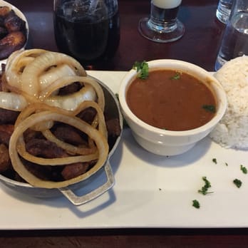 Vejigantes - Masitas de Cerdo Encebolladas (Boneless fried pork loin with onions) - Puerto Rican Near Me - Boston, Massachusetts Vejigantes - Masitas de Cerdo Encebolladas (Boneless fried pork loin with onions) - Puerto Rican Near Me - Boston, Massachusetts