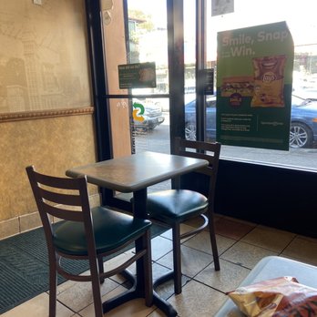 Subway - a table and two chairs in front of a window - Fast Food Near Me - Bronx, New York Subway - a table and two chairs in front of a window - Fast Food Near Me - Bronx, New York