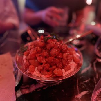 Basbussa - a bowl of food on a table - Middle Eastern Near Me - Los Angeles, California Basbussa - a bowl of food on a table - Middle Eastern Near Me - Los Angeles, California