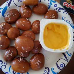 Pretzel bites with nacho cheese dipping sauce.