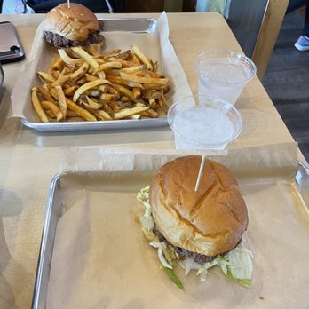 MOOYAH Burgers, Fries & Shakes - Build your own - 1/4lb meat, potato bun, lettuce/tomato/pickles/grilled onions, mooyah sauce. + Shareable Fries - Burgers Near Me - Irvine, California