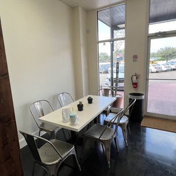 Casa Blanca - a table and chairs in an empty room - Coffee & Tea Near Me - Laredo, Texas