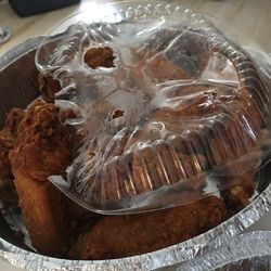 Our overdone wings in the melted top that didn't fit that was in the bag