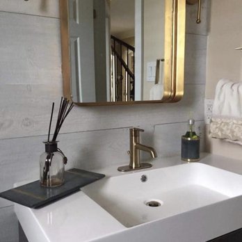 Vena Renovation - a sink and mirror in a bathroom - General Contractors Near Me Vena Renovation - a sink and mirror in a bathroom - General Contractors Near Me