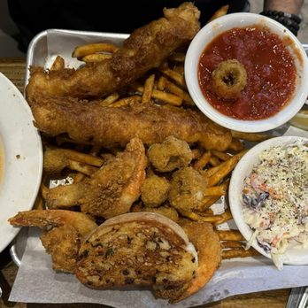 Trident Grill IV - Captains platter, (calamari, cod and shrimp w/fries and garlic bread - Sports Bars Near Me - Tucson, Arizona Trident Grill IV - Captains platter, (calamari, cod and shrimp w/fries and garlic bread - Sports Bars Near Me - Tucson, Arizona