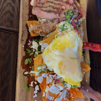 Clandestino Gastro-Bar - The trio chilaquiles with ribeyes was just delicious and good enough for 2 people my favorite was the red chilaquiles - Latin American Near Me - Azusa, California Clandestino Gastro-Bar - The trio chilaquiles with ribeyes was just delicious and good enough for 2 people my favorite was the red chilaquiles - Latin American Near Me - Azusa, California