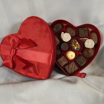 Betty's Chocolates - Valentine's Day - Satin Heart filled with assorted chocolates, 6 oz. $15.50. - Chocolatiers & Shops Near Me Betty's Chocolates - Valentine's Day - Satin Heart filled with assorted chocolates, 6 oz. $15.50. - Chocolatiers & Shops Near Me