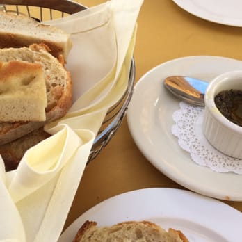 Tra di Noi - Complimentary bread basket with olive oil tapenade - Italian Near Me - Malibu, California Tra di Noi - Complimentary bread basket with olive oil tapenade - Italian Near Me - Malibu, California