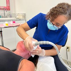 Leita Harris, MD - Nurturing You Women's Health & Wellness - Dr. Leita doing an aesthetics procedure.