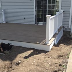 MKJC Carpentry - 12x16 low style deck with picture framed Trex pecan colored decking.