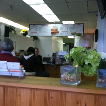 Capriotti's Sandwich Shop - a woman sitting at the counter - Sandwiches Near Me - Milford, Delaware Capriotti's Sandwich Shop - a woman sitting at the counter - Sandwiches Near Me - Milford, Delaware