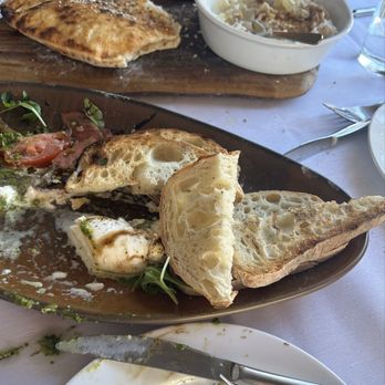 Mio Nonno Trattoria - What's left of the caprese, flat bread & cheese w/honey & nuts. - Bars Near Me - Flower Mound, Texas Mio Nonno Trattoria - What's left of the caprese, flat bread & cheese w/honey & nuts. - Bars Near Me - Flower Mound, Texas