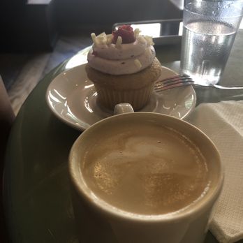 Molly's Cupcakes - Cortado with the White Chocolate Raspberry cupcake - Desserts Near Me - Chicago, Illinois Molly's Cupcakes - Cortado with the White Chocolate Raspberry cupcake - Desserts Near Me - Chicago, Illinois