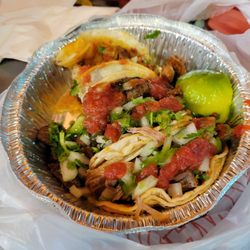 Tacos Tolteca - Steak, carnita and an el pastor taco trio complete with fresh Tortilla chip fast friendly and unexpectedly tasty I'll be back!