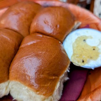 Trivoli Tavern - Parkerhouse rolls with truffle honey grass fed butter - American Near Me - Chicago, Illinois Trivoli Tavern - Parkerhouse rolls with truffle honey grass fed butter - American Near Me - Chicago, Illinois
