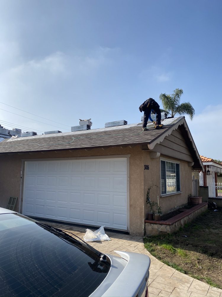 Slide of Olive Tree Roofing and Construction