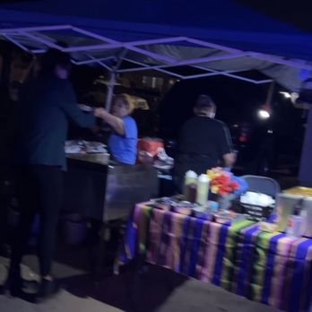Tacos El Gabacho   - group of people standing under a tent - Caterers Near Me