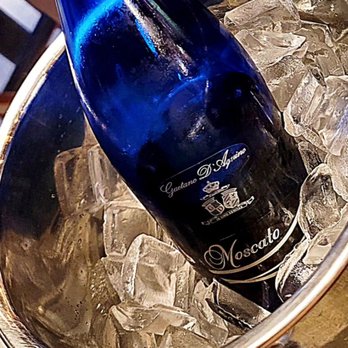 Mellow Grapes - a bottle of wine in a bucket of ice - Wine Bars Near Me - Miami, Florida Mellow Grapes - a bottle of wine in a bucket of ice - Wine Bars Near Me - Miami, Florida