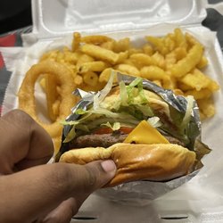 Champion Wings Fish - Cheeseburger n fries with one of my onion rings from my side order of onion rings