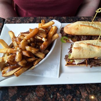 Symposium Cafe Restaurant - Philly handheld with poutine upgrade - Breakfast & Brunch Near Me - Woodbridge, Ontario