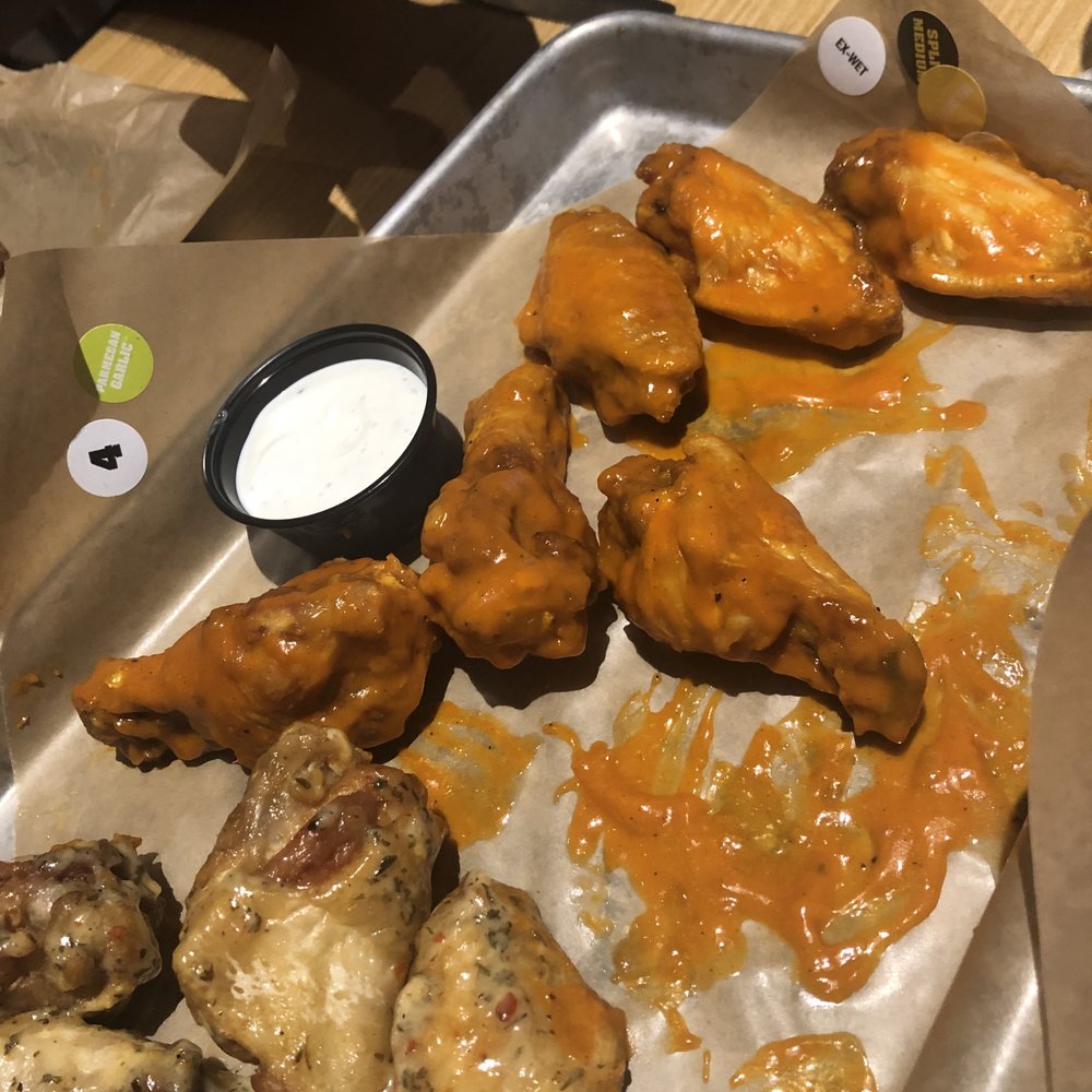 Buffalo Wild Wings - Sorry - we began to eat before the photo..LOL. To the left are the Parmesan Garlic wings, then Spicy Garlic and finally Buffalo. - American Near Me - Plano, Texas